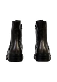 Stivaletti neri in pelle con una superficie liscia, zip laterale e una robusta suola in gomma nera; presenta dettagli di cucitura minimi.