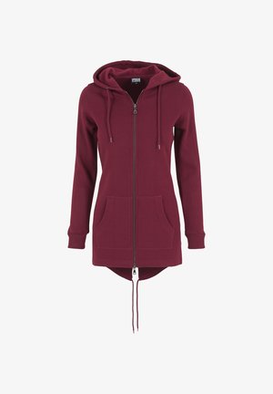 Bordo zip-genser med hette og snøring, lange ermer, frontlommer, og en litt lengre bakkant. Myk stoffkvalitet og ribbestrikkede mansjetter.