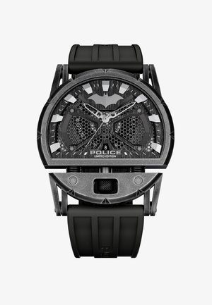 Črna omejena izdaja ročne ure s hexagonalnim vzorcem na številčnici, s sivojimi poudarki in simbolom netopirja. Ima gumijast pas in ohišje iz nerjavnega jekla.