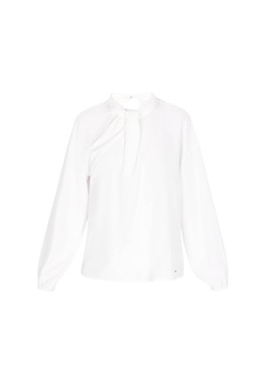 Blouse blanche à manches longues avec un col montant et un détail froncé à l'avant. Fabriquée en tissu lisse avec une texture douce. Présente une fermeture éclair discrète.