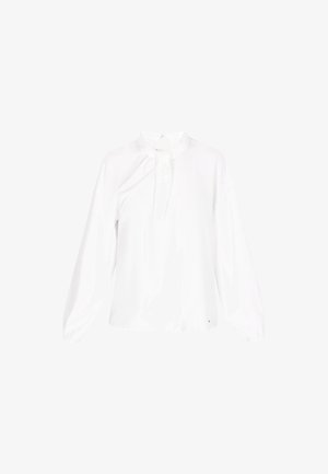 Blouse blanche à manches longues avec un col montant et un détail froncé à l'avant. Fabriquée en tissu lisse avec une texture douce. Présente une fermeture éclair discrète.