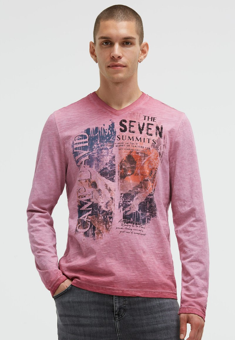 Long-sleeve, pink cotton T-shirt featuring a graphic print with text reading "THE SEVEN SUMMITS." V-neck design and casual fit.