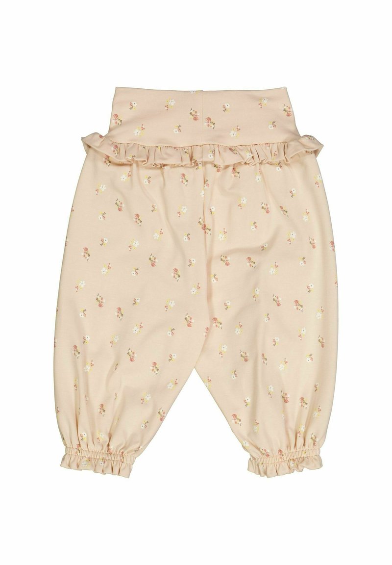Jasnoróżowe bawełniane spodnie z falbaną w pasie i kwiatowym wzorem. Elastyczne mankiety przy kostkach. Miękka tekstura i luźny krój.