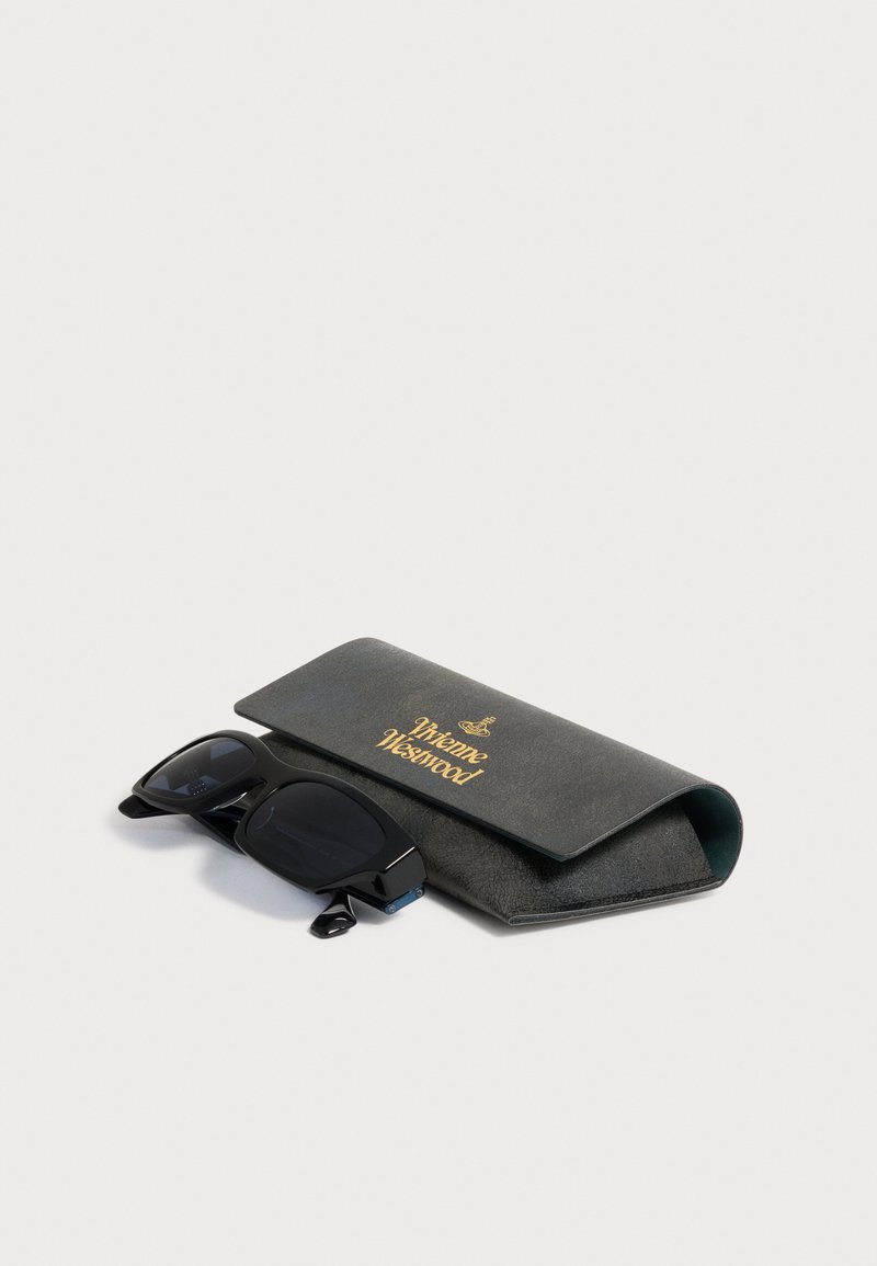 Black rectangular sunglasses next to a black case with gold Vivienne Westwood logo on a white background.
