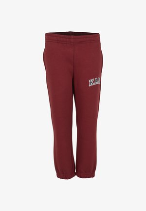 Bordeauxrode joggingbroek met elastische tailleband en boorden, zijzakken en witte "KAN" letters op het bovenbeen.