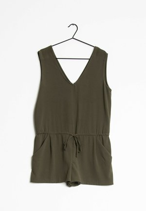 Sleeveless olive green romper with V-neck, drawstring waist, and pockets hanging on a black hanger against white background.