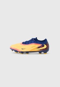 Nike soccer cleat featuring a yellow and orange gradient upper with textured stripes, blue heel, and black branding, complemented by yellow studs.
