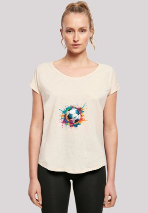 Light beige t-shirt with short sleeves, featuring a colorful splatter design around a black and white soccer ball on the front.