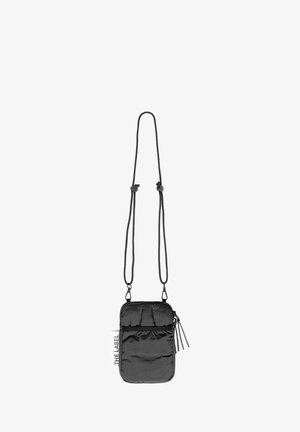 Black nylon crossbody bag with a zip closure, featuring a front pocket and adjustable straps. Textured surface and tag visible.
