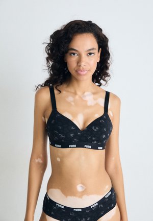 Bralet s uzorkom crnog leoparda od mekog materijala, s podesivim trakama i elastičnom trakom s brendom. Uz to, odgovarajuće gaćice s uzorkom crnog leoparda.