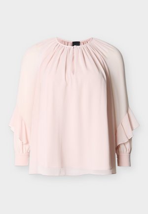 Light pink blouse with long bishop sleeves, ruffle details near cuffs, gathered neckline, and small keyhole opening at front center.