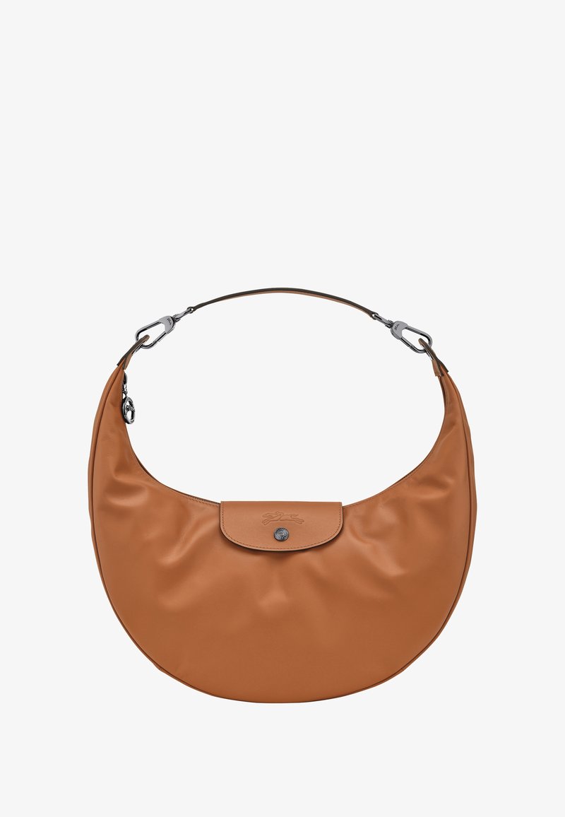 Brown crescent-shaped leather handbag with a single strap, flap closure with a button, and metal clasp attachments.