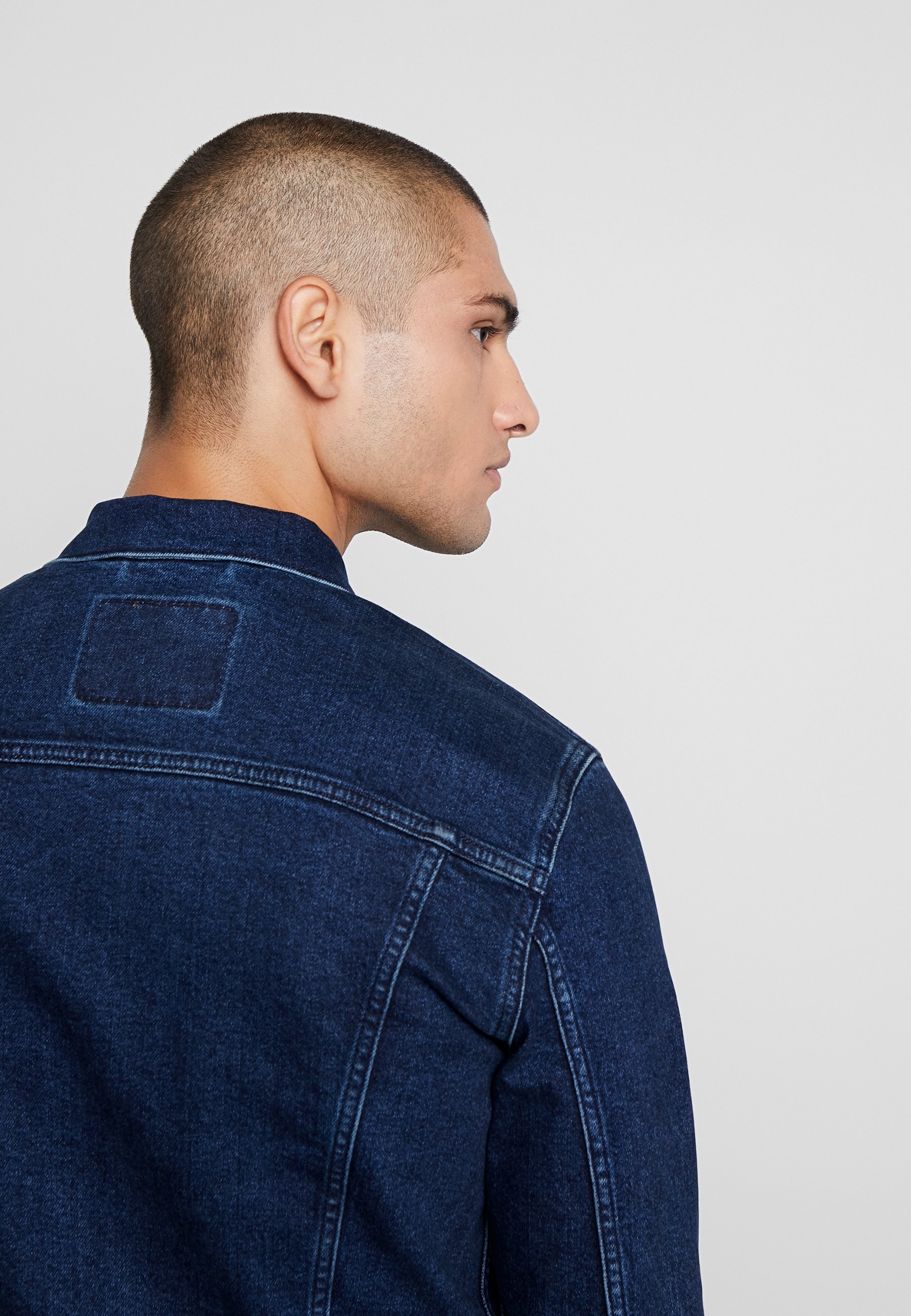 dark blue trucker jacket