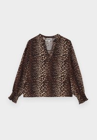 Blouse à manches longues avec imprimé léopard marron et noir, col en V et poignets élastiqués froncés sur un fond uni clair.
