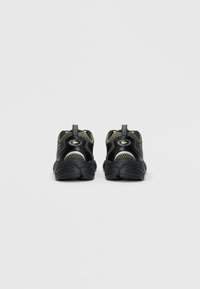 Pair of black and olive green mesh sneakers with black soles and a crocodile logo viewed from the back on a plain white background.