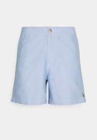 Ljusblå bomullsshorts med elastisk midja och knappstängning. Sidorsömmarna har minimal sömnad och en liten logo på benet.