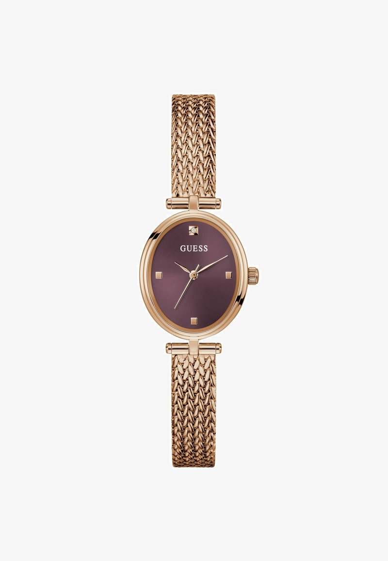 Montre en or rose avec un bracelet texturé et un cadran rond violet foncé, comportant des accents dorés et des index carrés. Nom de la marque affiché.