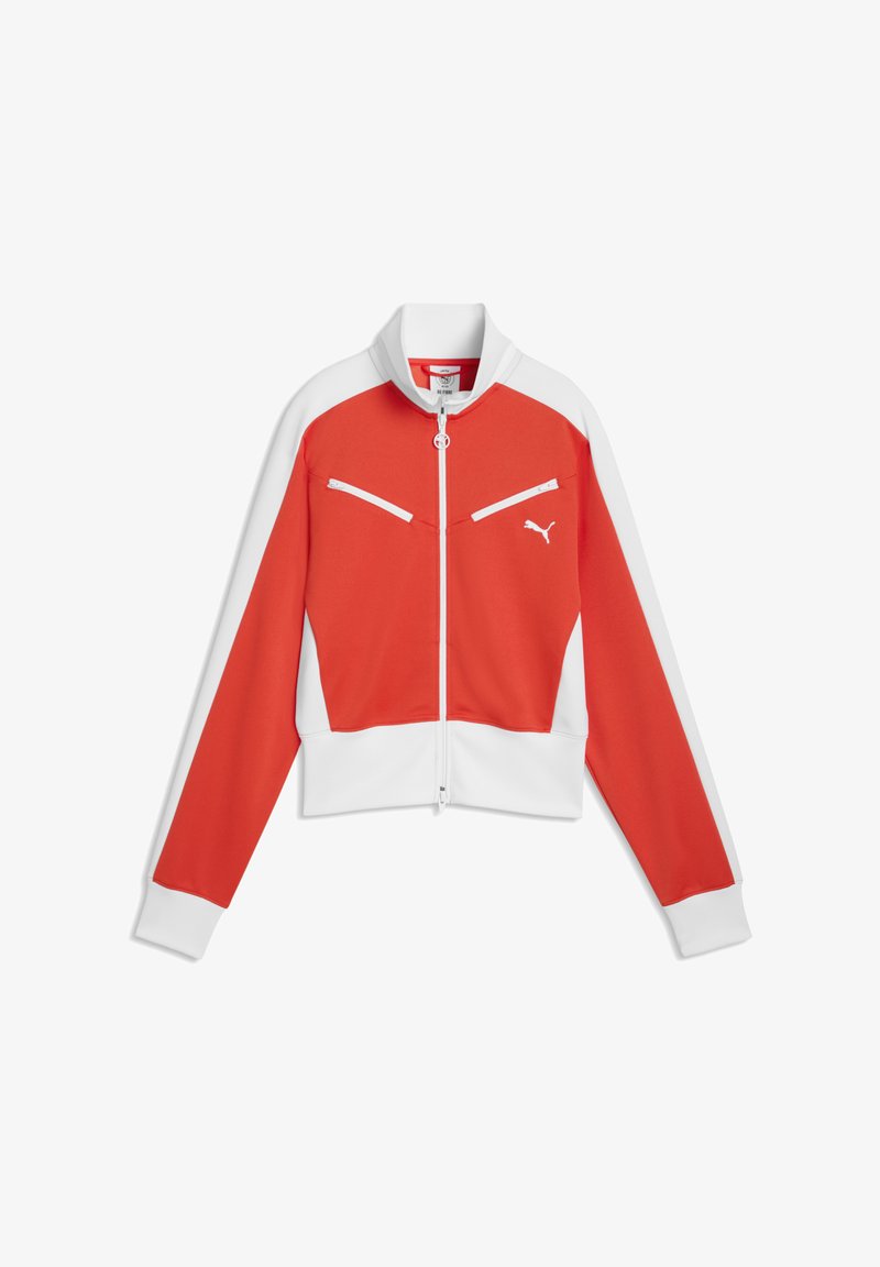 Veste de sport rouge et blanche zippée avec col montant, deux poches diagonales zippées et un logo Puma sur la poitrine.