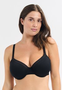 Black padded bra with adjustable straps, lace trim along the top edge, and a smooth texture. This item features a classic, molded shape.