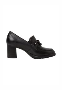 Mocassin à talon en cuir noir avec talon bloc épais, bout arrondi et détail décoratif de chaîne surdimensionnée sur le dessus.