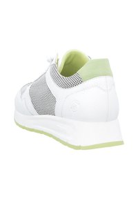 White sneaker with mesh panels, green accents, and a textured leather finish. Features a cushioned sole and a lace-up design.