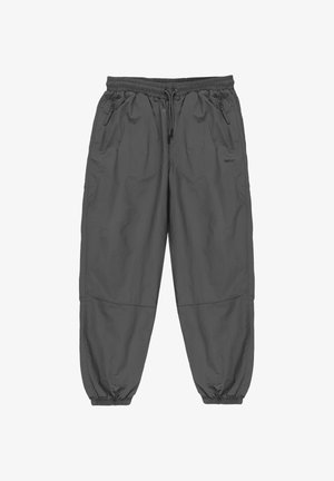 Szare, lekkie spodnie z elastycznym pasem, kieszeniami na zamek i elastycznymi mankietami. Gładka faktura, luźny krój i minimalistyczne logo.