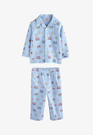 Világoskék gyerek pizsama, gombos felsővel és rugalmas derekú nadrággal, londoni témájú mintákkal, amelyek őröket, buszokat, kutyákat és koronákat ábrázolnak.