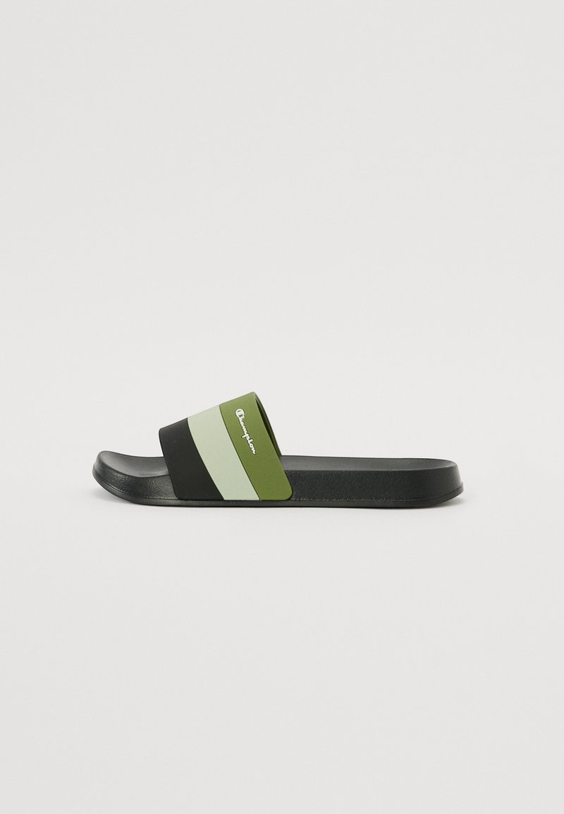 Black and green slide sandal with a broad strap featuring horizontal stripes in two shades of green. Textured sole for grip.