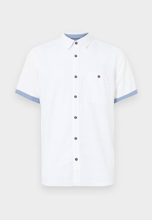 Korte mouwen witte shirt, katoen, met knoopsluiting, blauwe accenten op de mouwen, één borstzak, vijf donkere knopen.