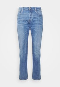 Ljust blå slim-fit jeans med knäppning och dragkedja, fram- och bakfickor samt blekta detaljer på låren och knäna.