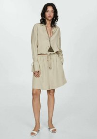 Mango Pantaloni de trening - mottled olive