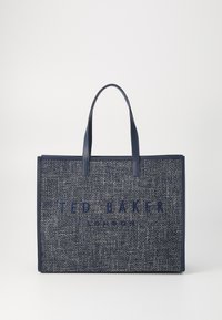 Marineblauwe totebag van textuurstof met twee handvatten, voorzien van een geperst 'TED BAKER LONDON' logo aan de voorkant.