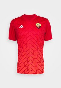 Maillot de football rouge à manches courtes avec motif géométrique, logo blanc d'Adidas sur la poitrine droite, écusson de l'AS Roma sur la poitrine gauche.