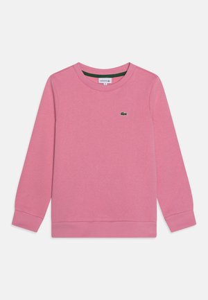 Sweat-shirt rose en matière douce, doté d'un col rond, de poignets côtelés et d'un petit logo vert sur la poitrine. Design uni.