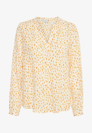 Long-sleeve blouse in light cream fabric, featuring an all-over orange abstract dot pattern, with a v-neckline and relaxed fit.