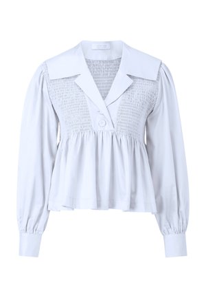 Blusa bianca con scollatura arricciata, colletto oversize e maniche lunghe a sbuffo con polsini con bottoni. Orlo svasato per una vestibilità comoda.