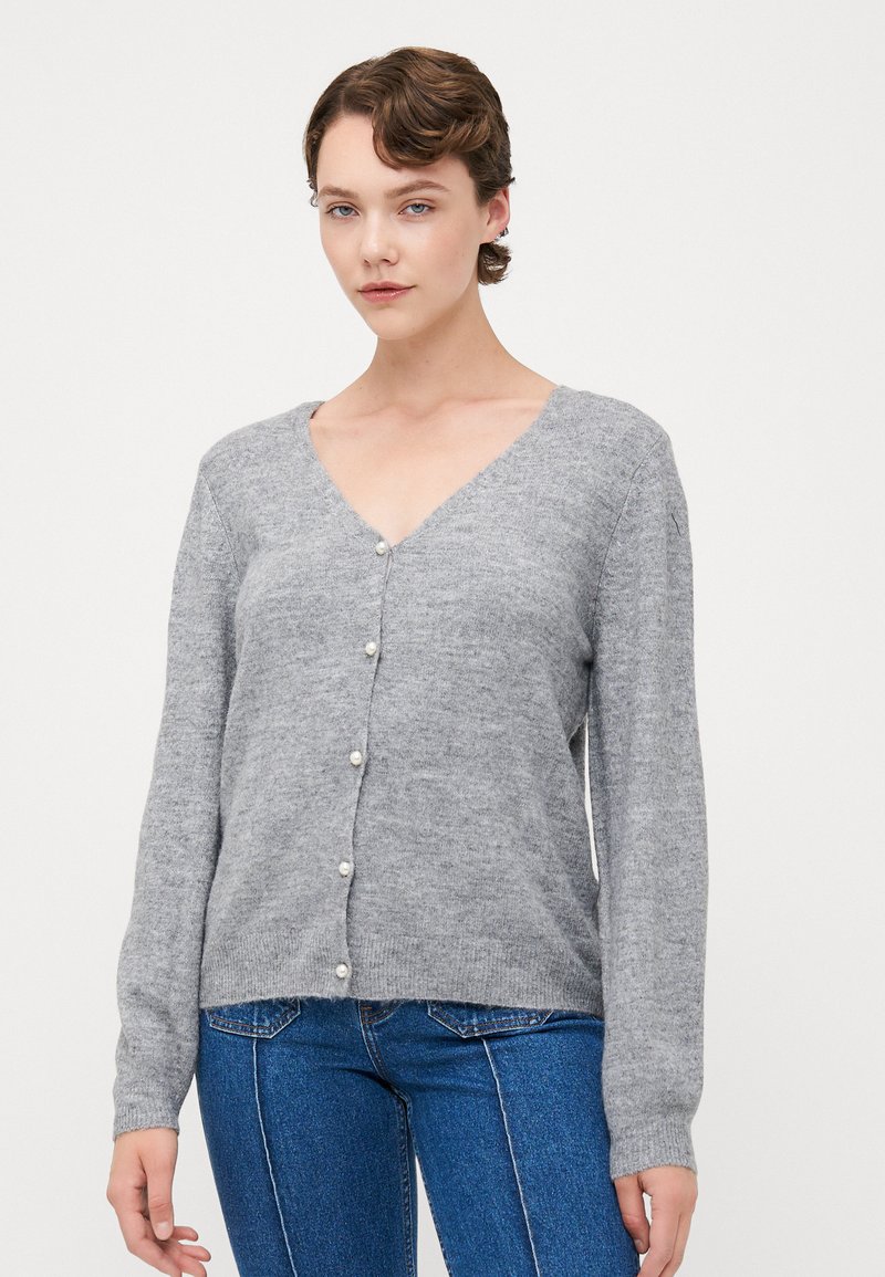 Gray knitted cardigan with v-neck, long sleeves, and five pearl buttons down the front. Soft texture, straight hem, and lightweight design.