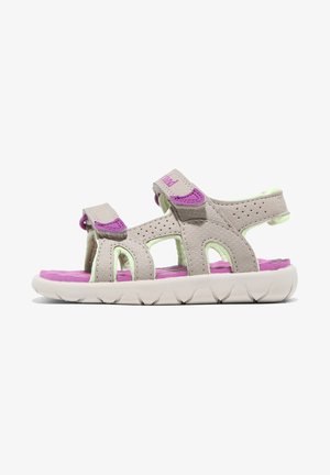 Beige og pink børnesandal med åben tå, justerbare stropper, perforerede detaljer og en polstret sål for komfort og støtte.