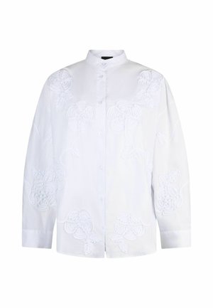 Blouse blanche à manches longues avec boutons, col montant, broderie florale subtile et coupe décontractée.