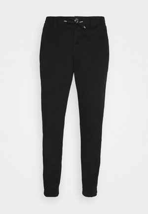 Pantalon de jogging noir fuselé avec des poignets élastiques, des passants de ceinture, un bouton avant, une fermeture éclair et une taille à cordon de serrage.