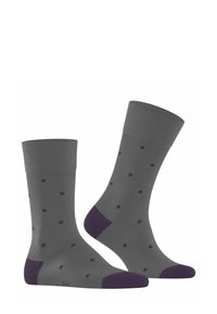 Calze grigie con accenti viola e pois, angolate per mostrare il design e il dettaglio del bordo, posizionate su uno sfondo bianco.