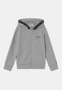 Szara bluza z kapturem na zamek, wykonana z mieszanki bawełny, z logo na piersi, dwoma przednimi kieszeniami i czarnymi wzorzystymi akcentami wewnątrz kaptura.