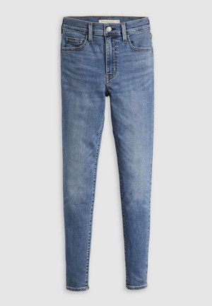 High-waisted skinny traperice u srednje plavoj boji s laganim izblijedjenjem, pet džepova i prednjim zatvaračem te kopčanjem na dugme. Klasičan detalj šivanja.