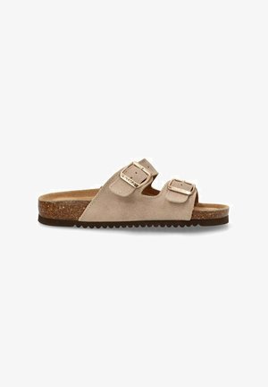 Sandalia deslizante de ante beige con dos hebillas ajustables, plantilla de corcho y suela de goma texturizada. Diseño de punta abierta y ajuste casual.