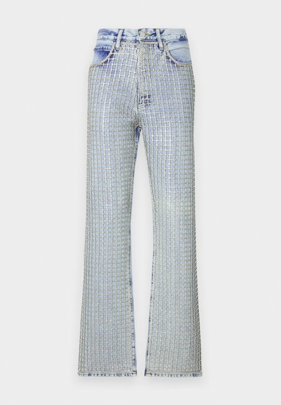 Light blue denim flared jeans featuring a grid pattern of silver embellishments, with a high-waisted design and frayed hem.