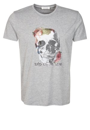 T-shirt en coton gris avec un design imprimé de skull orné de fleurs colorées, avec le texte "FIN DE L'AMOUR" en dessous du graphique.