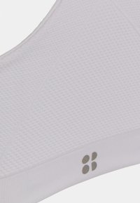 Sweaty Betty FOUNDATION SEAMLESS YOGA BRA - Sutiã desportivo de suporte ligeiro - white