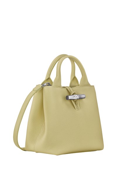 Yellow textured leather handbag with dual handles, a removable shoulder strap, and a silver hardware accent. Rectangular shape with a zip closure.