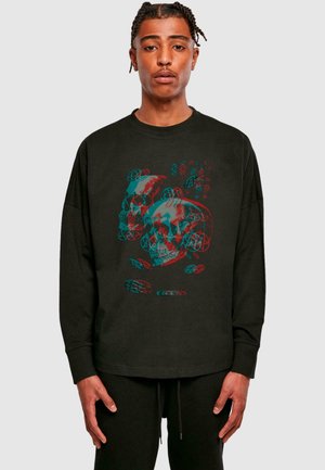 Black long-sleeve t-shirt featuring a graphic of overlapping skulls in red and teal. Fabric has a soft texture with a relaxed fit.