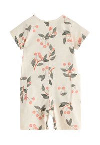 Rompers a maniche corte in cotone con sfondo crema chiaro, caratterizzato da un motivo floreale di ciliegie rosa e foglie verdi; include tasche laterali.